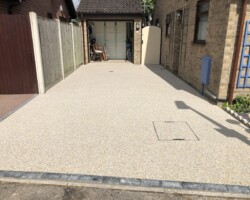 After - Driveway Finished In Seashore With Charcoal Block Edging