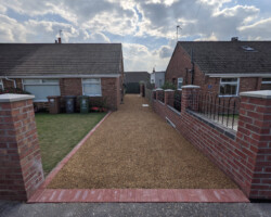 After - Red Block Edging, 2 New Manholes Installed, Finished In Tar And Stone