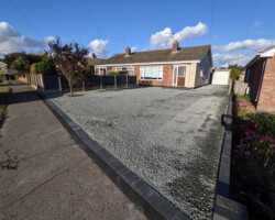 After - Area Excavated, Type 1 Base Installed, Charcoal Block Edging, New Resin Step, Finished In Grey Granite Tar And Stone