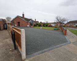 After - Driveway Widened, Charcoal Block Edging Installed, Finished With Hot Tar & Grey 6mm Granite
