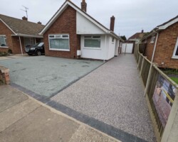 After - Charcoal Block Edging Installed, Main Drive Finished In Domino Resin Bound, Grass Area Finished In Hot Tar And Grey Granite