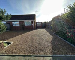 After - New Kerbs Installed, Existing Drive Removed, Finished With Hot Tar & Stone