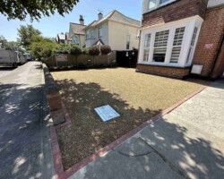 After - New Manhole Installed, Red Block Edging, Finished With Hot Tar & 10mm Golden Gravel