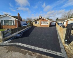 After - Charcoal Block Edge Installed / New Manhole & Drainage - Finished in 10mm Asphalt