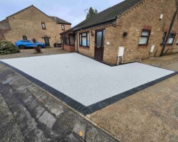 After - Charcoal Block Edge Installed / Finished in Azzuro Blue Resin Bound