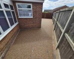 After - Brindle Block Edge Installed / New Recess Manholes / Finished in Evening Rose Resin Bound